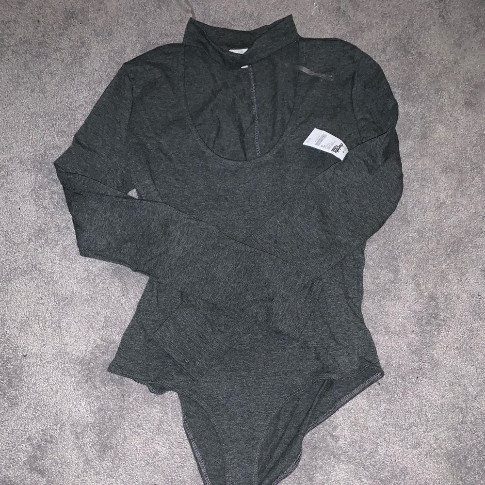 Grey one piece, long sleeve.